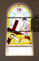 Stained glass windows depicting Stations of the Cross. Number 9.