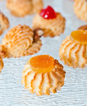 Almond pastries decorated with orange candied.