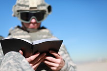 soldier reading a Bible