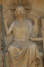 statue of Jesus with his hands raised