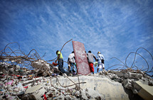 Men clearing disaster debris