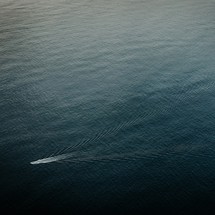 aerial view over a boat on the water 