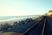 train tracks on a beach 