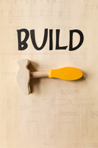 word build and a wooden hammer 