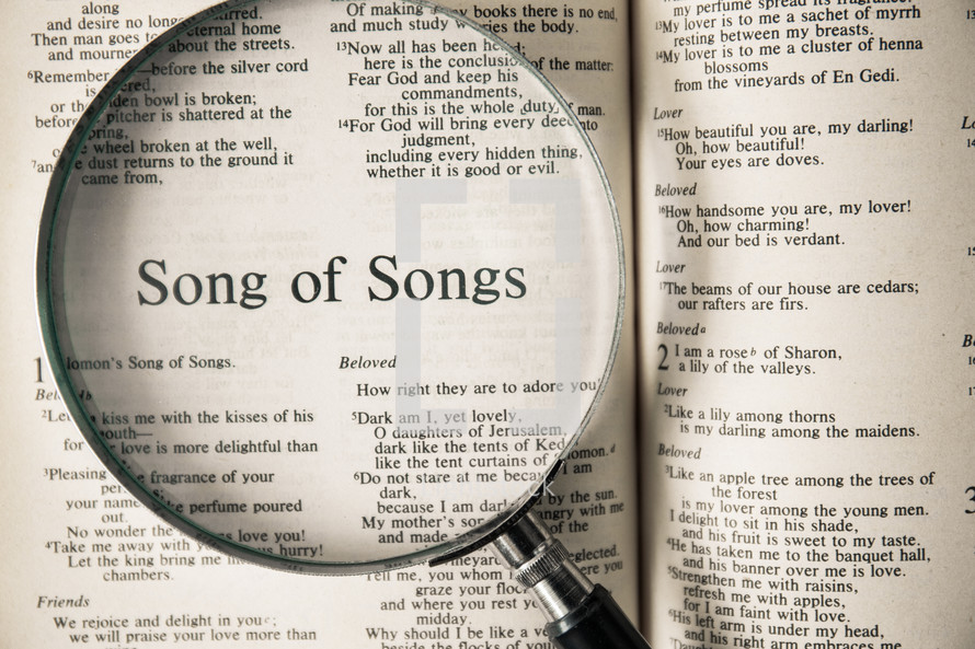magnifying glass over Bible - Song of Songs 