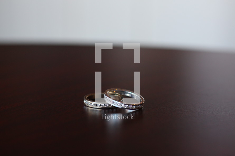 wedding rings on a table 