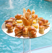 poolside Buffet of savory bread and croissants.