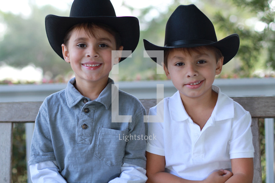 brothers in cowboy hats