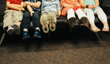 kids sitting on a couch 