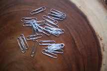 paperclips on wood 