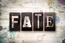 word fate on wood background 