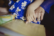 mother and daughter reading a children's Bible together