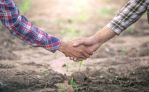 two farmers shaking hands