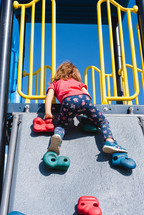 child playing on a playground 