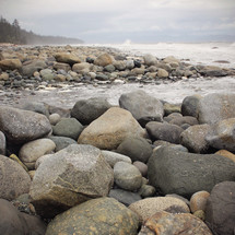Rocks and boulders on the ocean's edge.