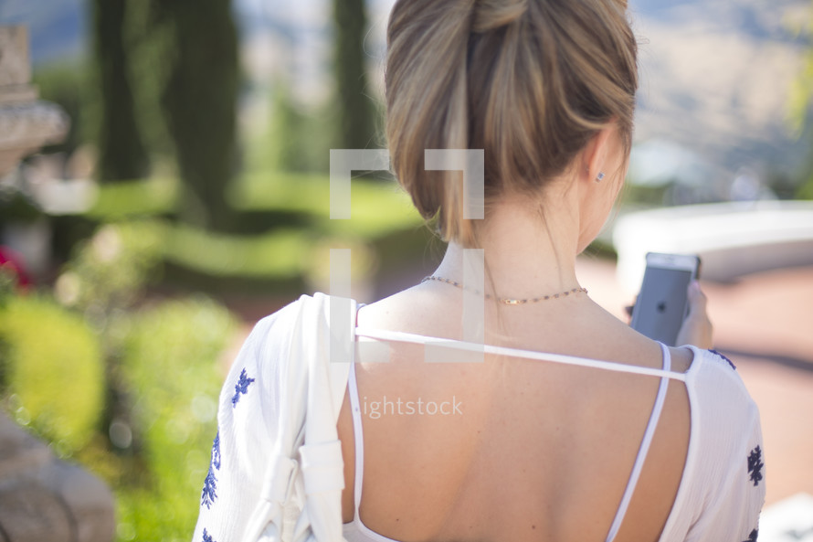 back of a woman's head with her hair pulled up 