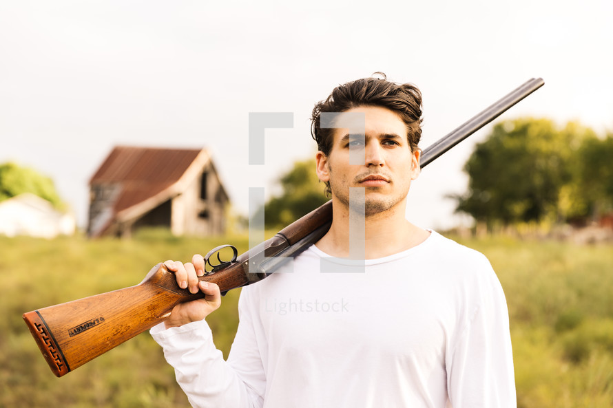a man with a shotgun 