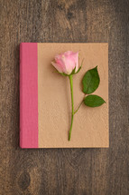 pink rose on a journal 