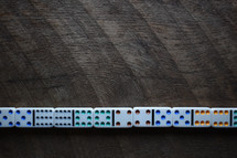 dominos against a wood background 