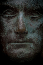 stoic face statue 