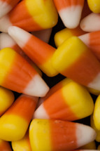 candy corn on a black background 