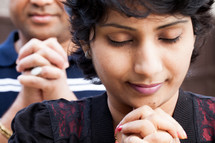 an Indian couple praying together 