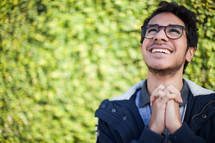 a praying man smiling looking up to God 