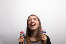 young woman and vote election day buttons 