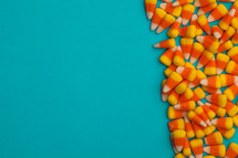 border of candy corn on a blue background 