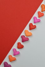hearts, pink, orange, red on white and red background 