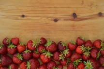 a border of fresh red strawberries 