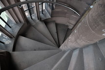 circular stairs from the belfry in an old cathedral. 
old, stair, stairs, stairway, spiral, staircase, circular, winding, old, stone, step, 