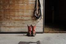 cowboy boots in a stable 