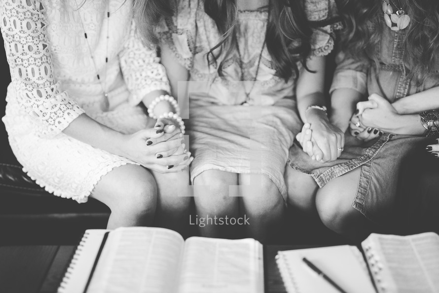 women's group praying together 