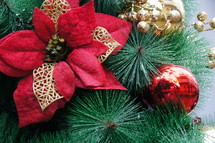 poinsettia ornament on a Christmas tree