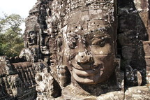 buddhist sculpturea in towers of Bayon temple
