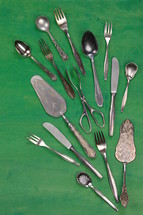 silverware on a green background 