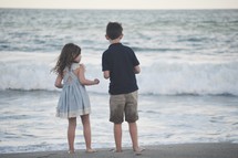 siblings on a beach 
