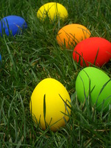 Multicolored Easter eggs in the grass. 