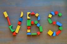 colorful wooden toy blocks with VBS
