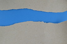 blue under gray torn paper 
