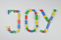 word joy of colorful toy wooden blocks
