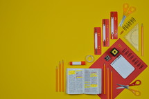 office supplies in red and yellow and Bible 