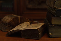 reading glasses on old books 