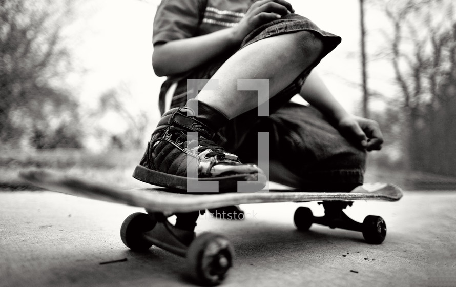 legs on a teen boy on a skateboard