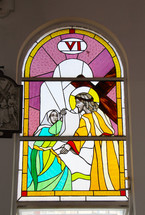 Stained glass window depicting Stations of the Cross. Number  6