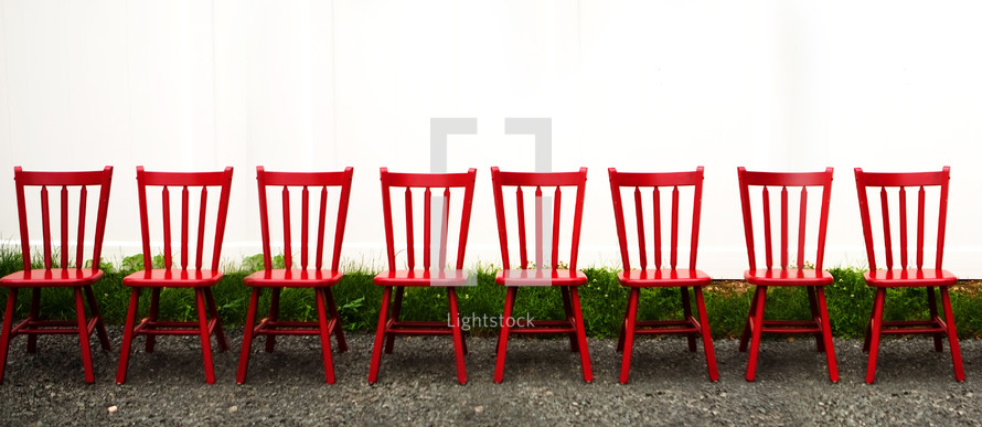 Row of red chairs outside