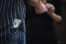 cash in a man's back pocket