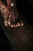 Jesus' feet nailed to the cross