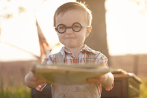 A little boy wearing glasses